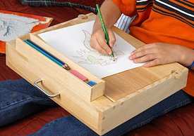 A divider forms separate areas for paper and a lift-out pencil box.